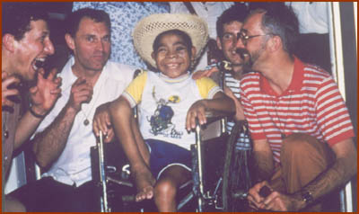 Brothers with boy in wheelchair
